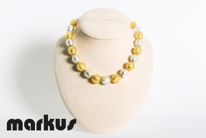 Glass necklace with round beads white and yellow gold leaf